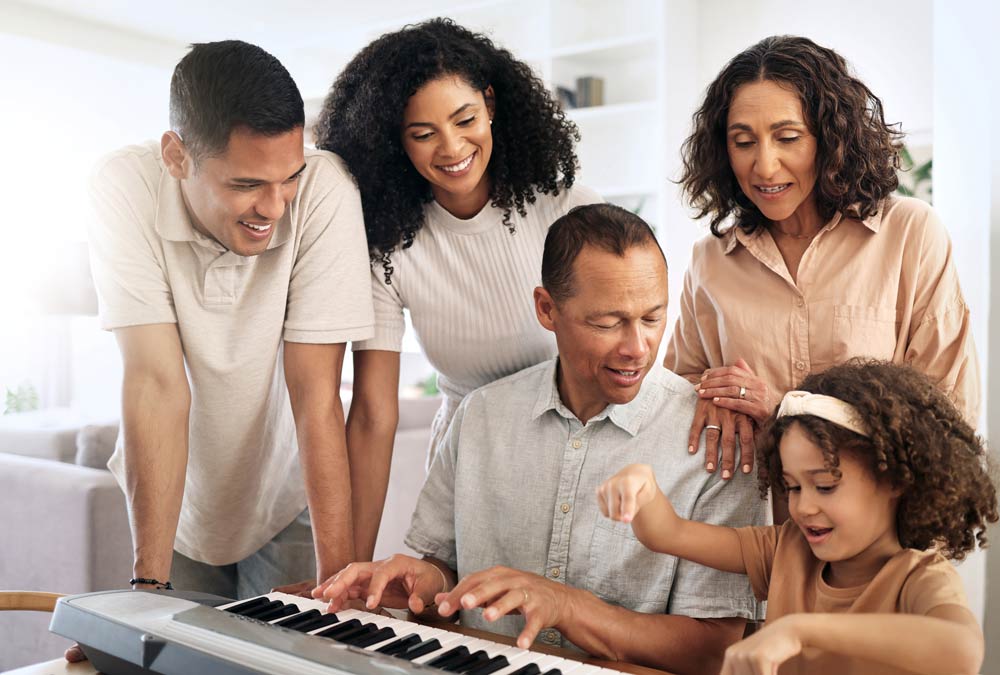 Diverse group of people playing piano